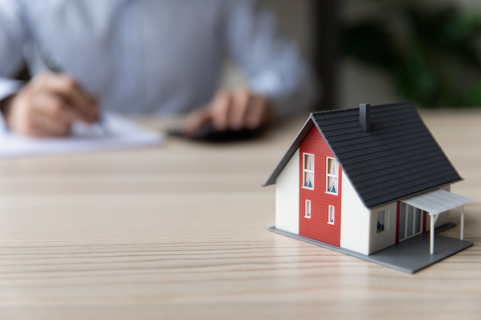 Close up of small toy miniature model of house