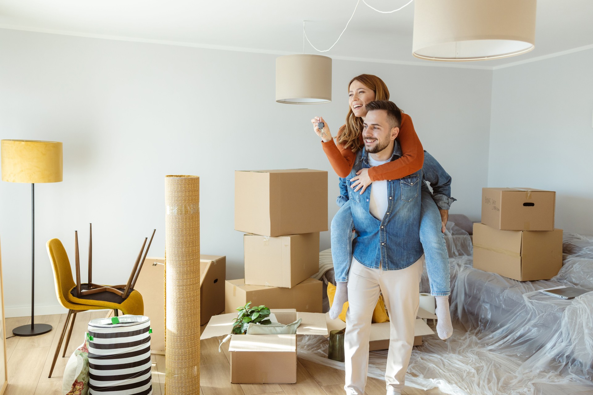 Happy couple enjoying their new home. Moving day